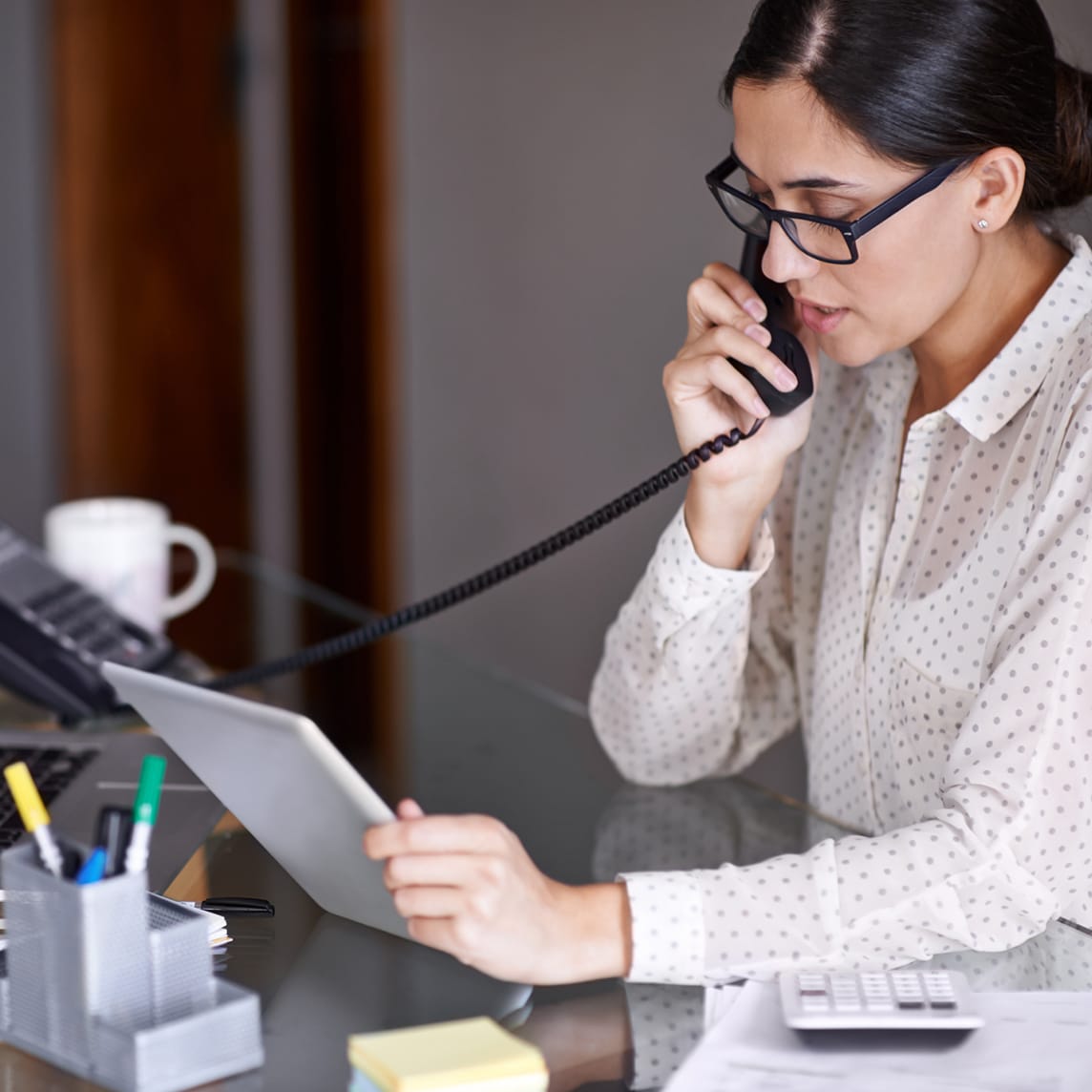 woman using AT&T business phone and internet