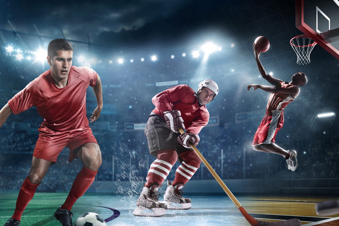 Sports action shot of hockey, basketball and soccer players.