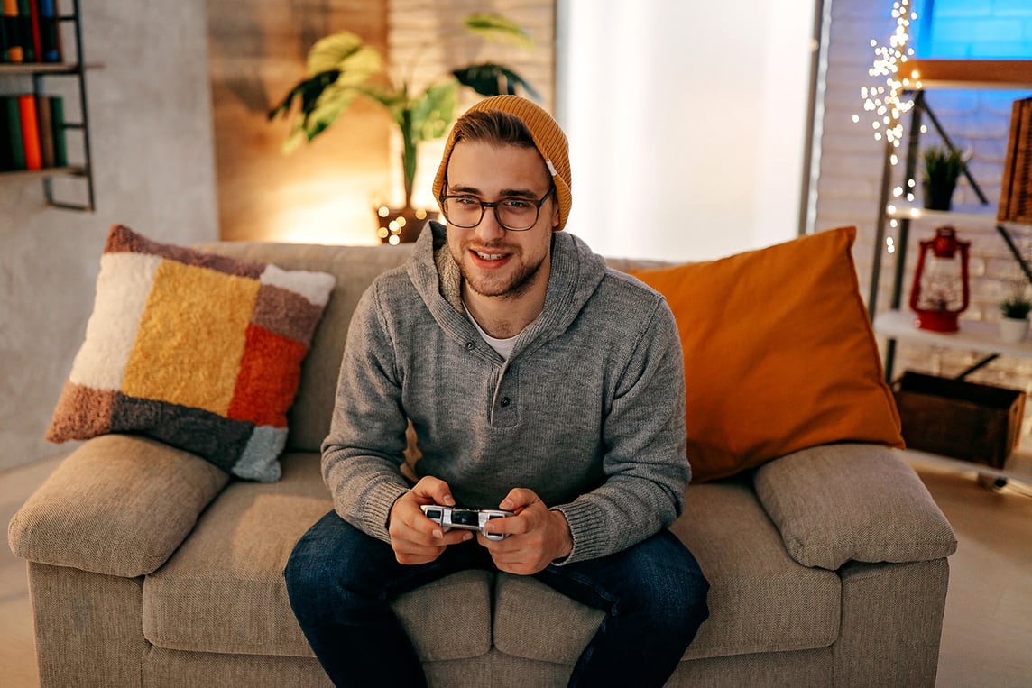 Young adult playing video games