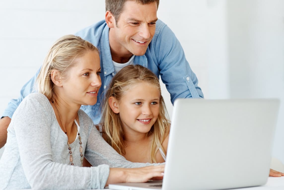 parents and daughter using internet