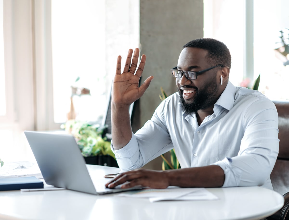 man using Quantum Fiber internet on a conference call