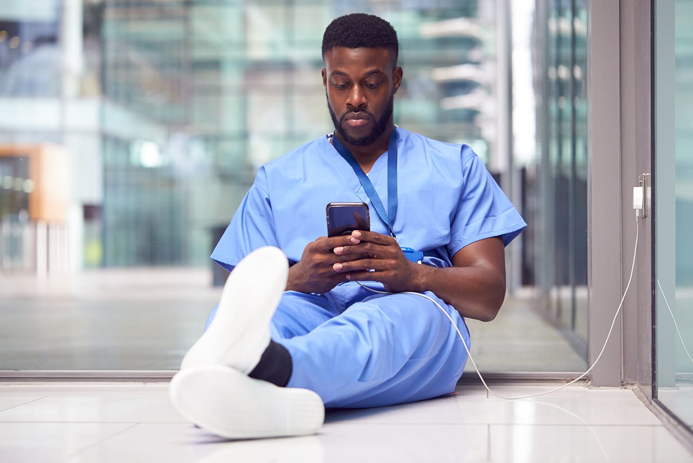 Male nurse using phone