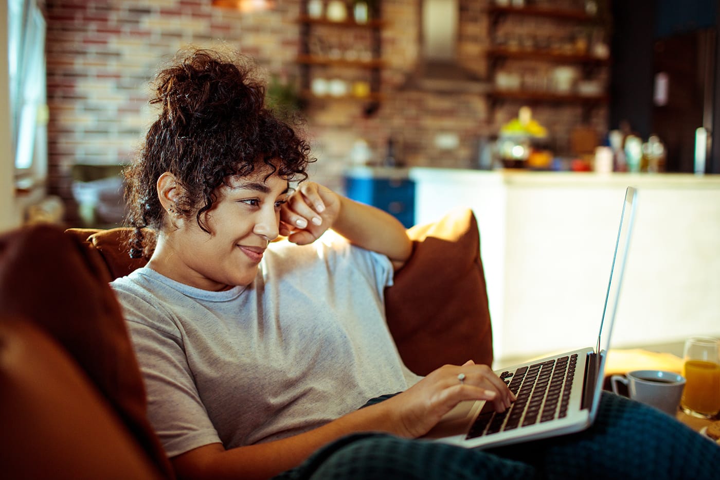 woman watching tv on laptop