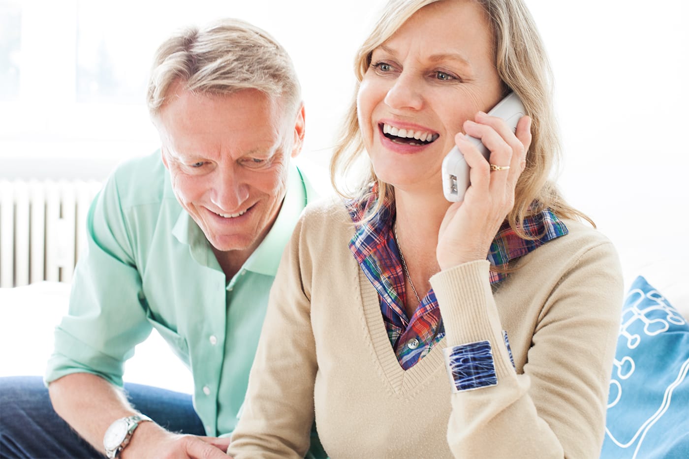 wife and husband talking on phone