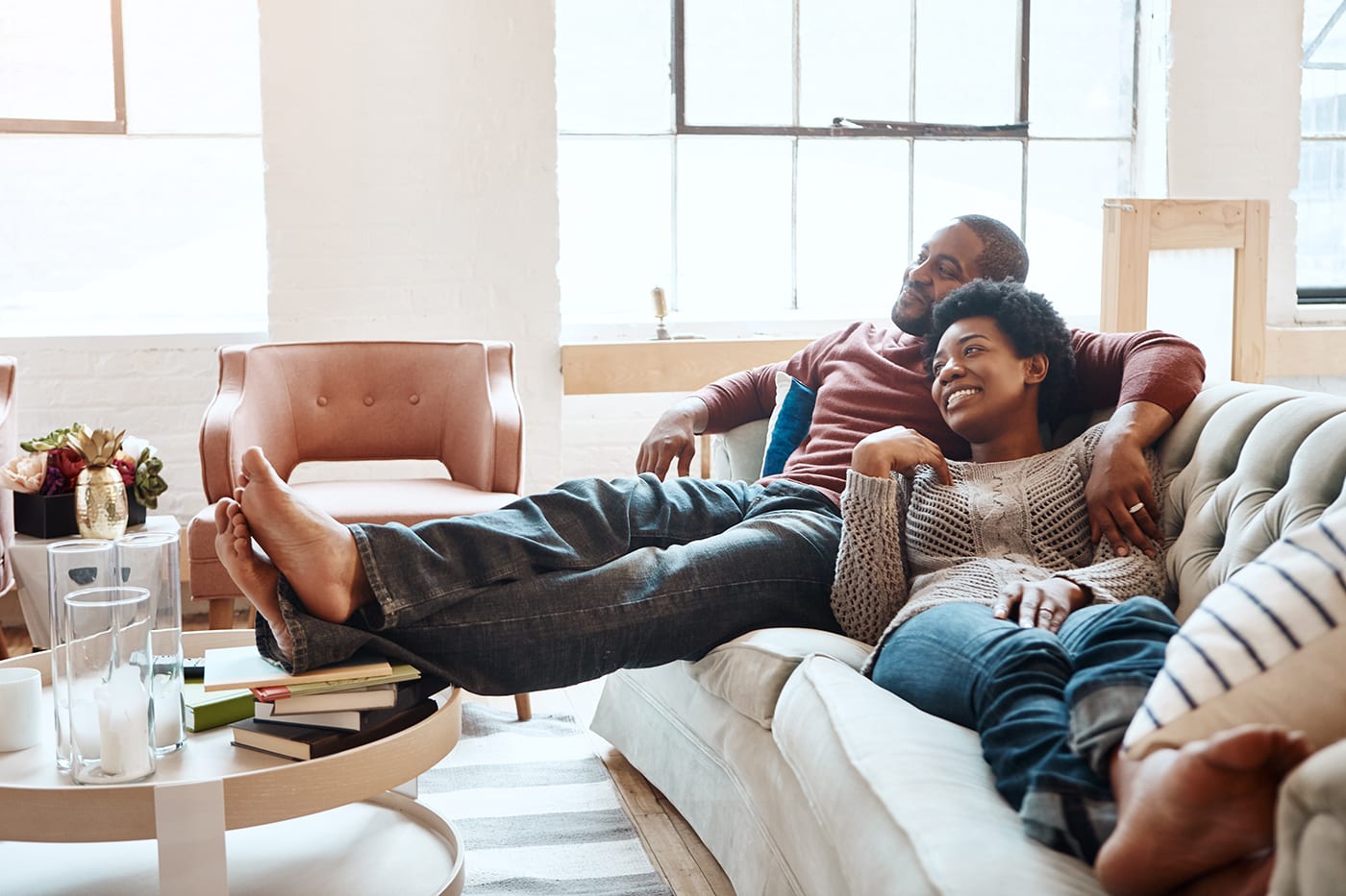 Couple on couch watching tv