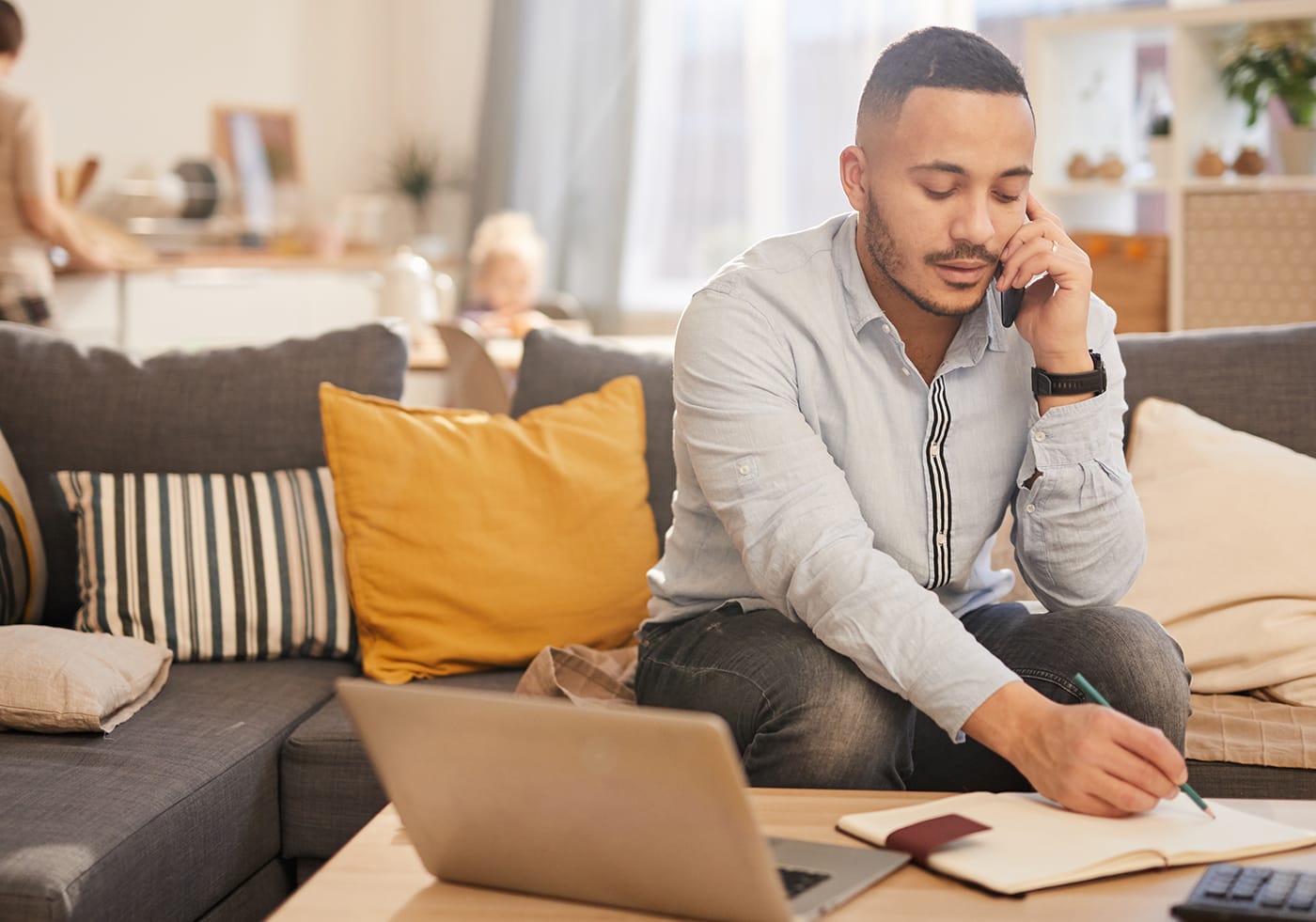 Man on phone working from home