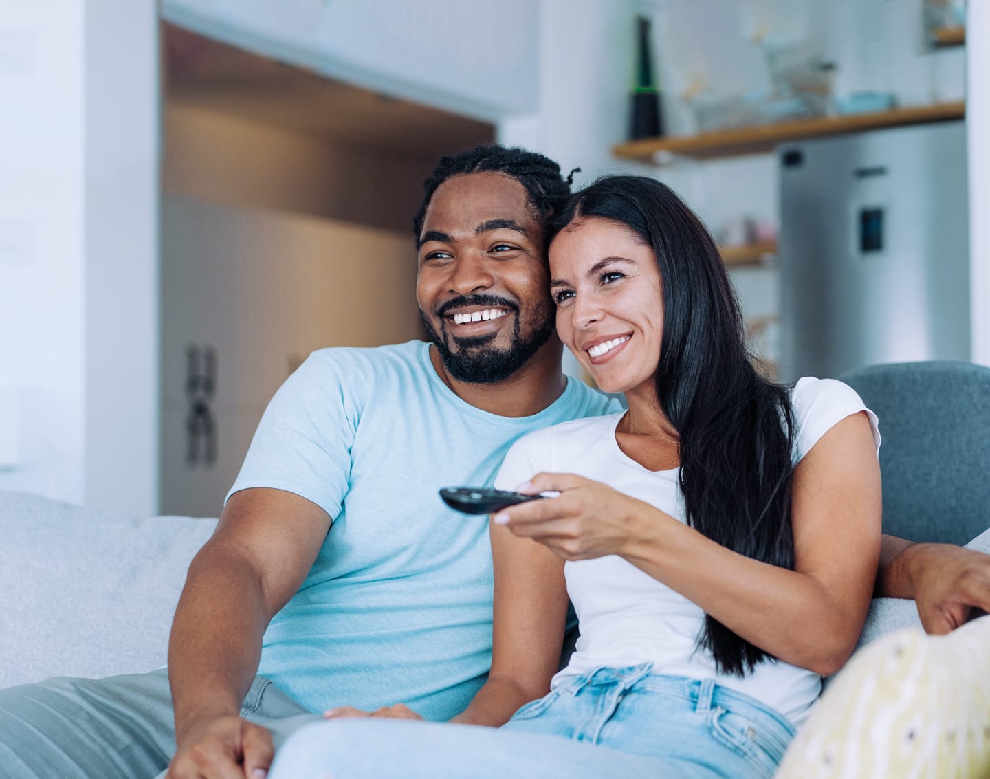 a couple watching Directv together