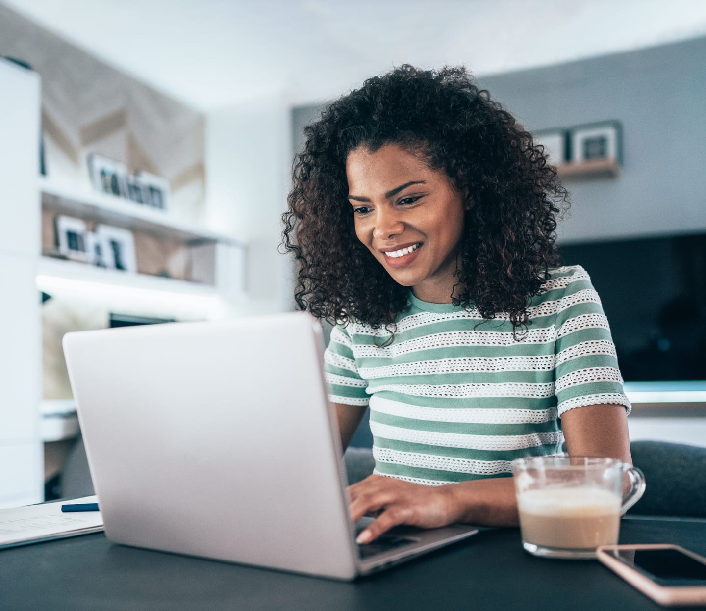 woman on laptop in her kitchen