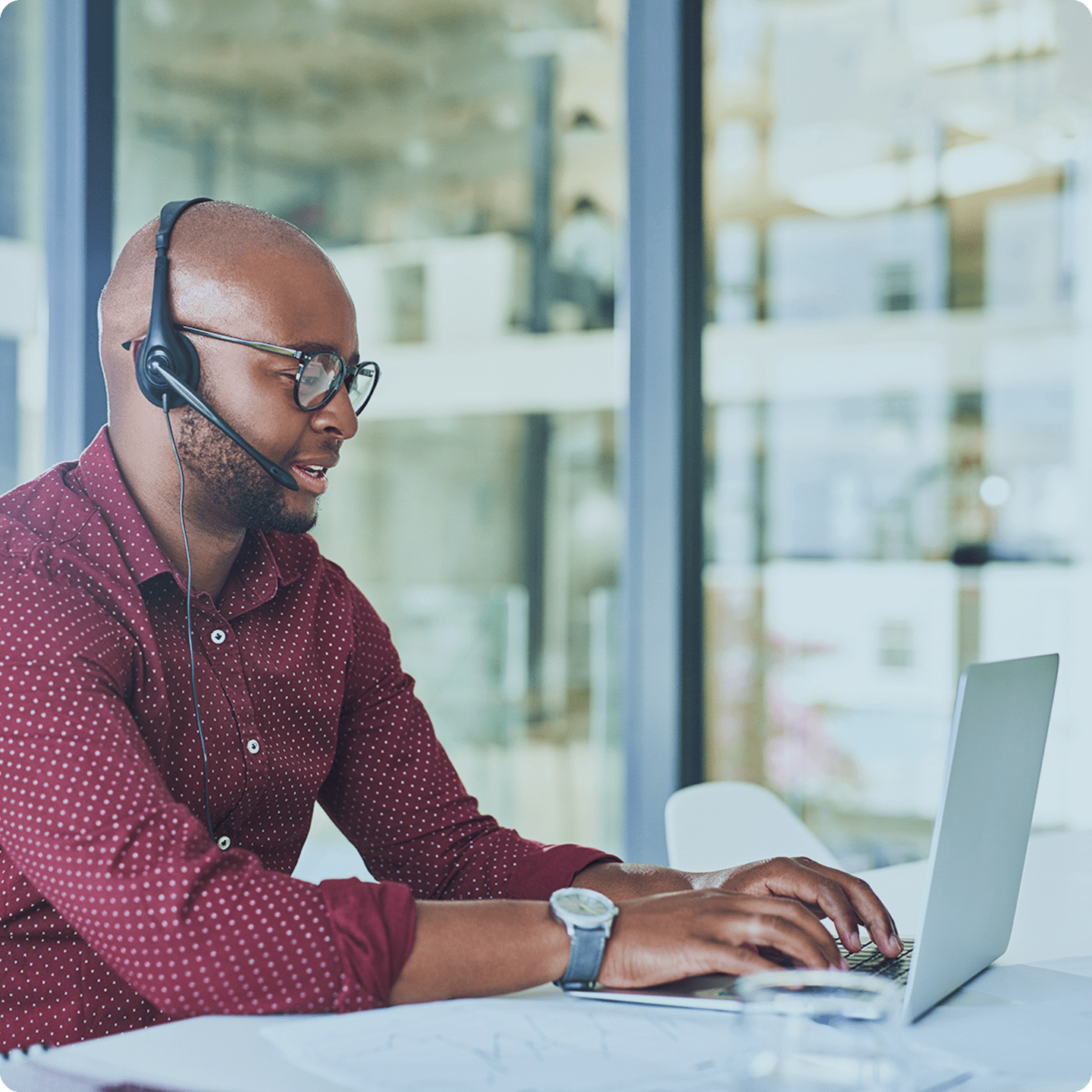 man working at his computer in a Vivint monitoring center