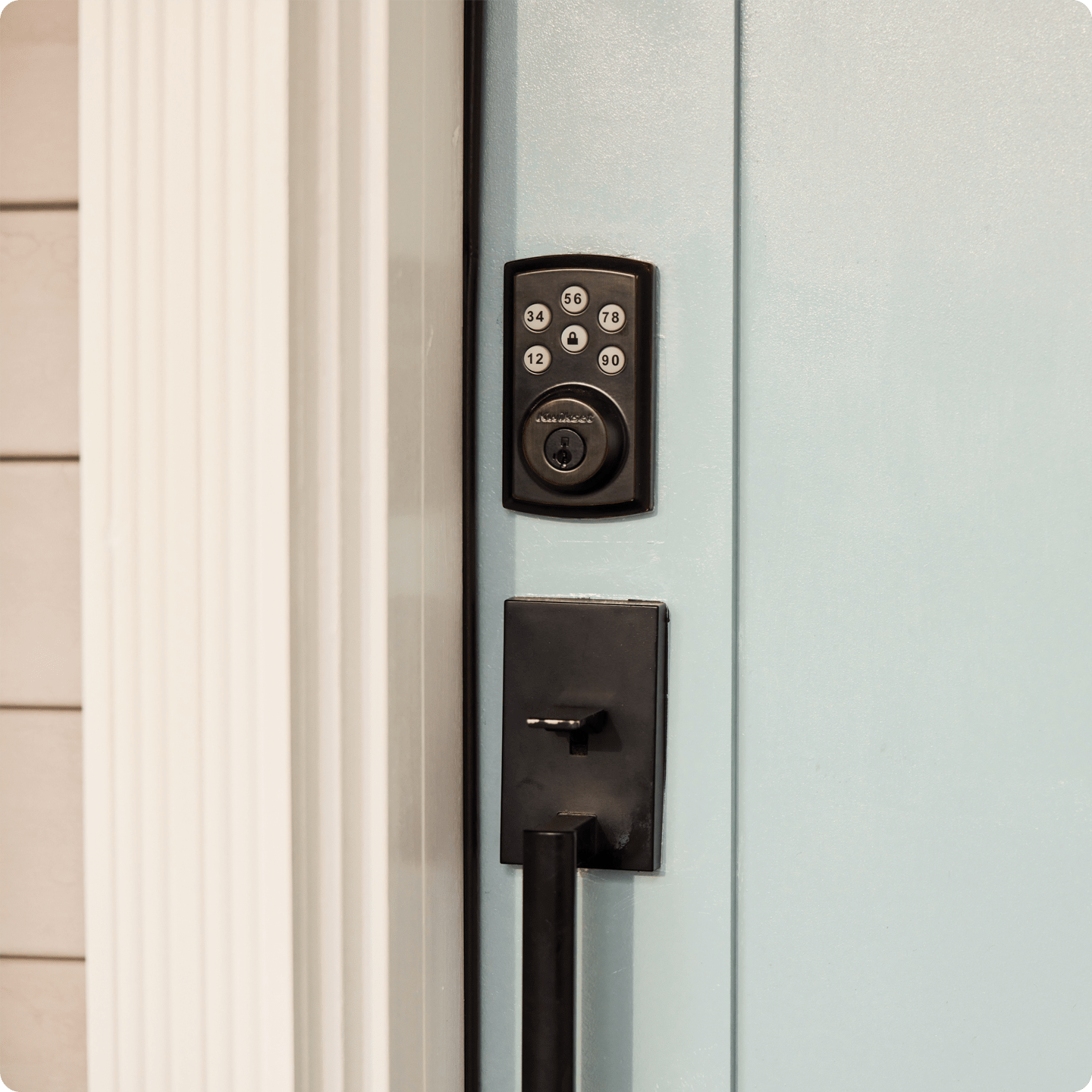 smart door lock on light blue door