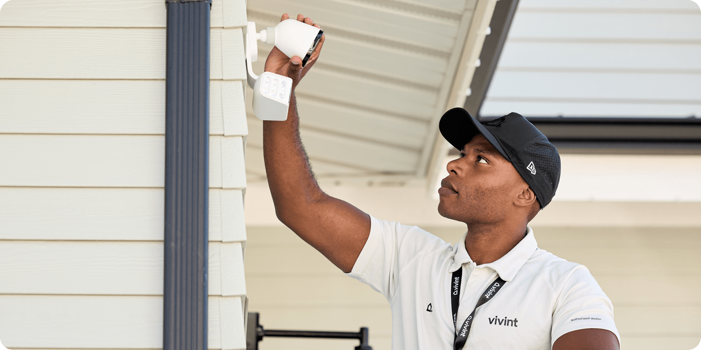 Vivint Installer setting up an outdoor camera