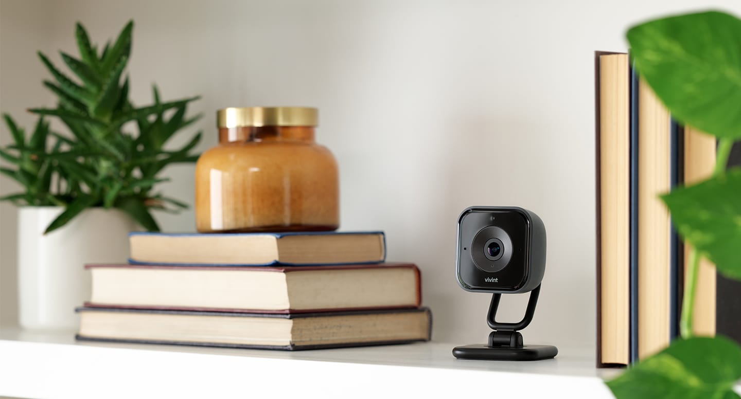 Vivint indoor camera pro on a bookshelf