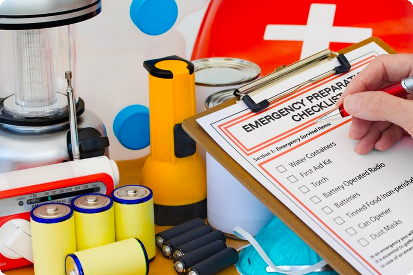 An emergency preparedness checklist on a clipboard checking over emergency preparedeness items.