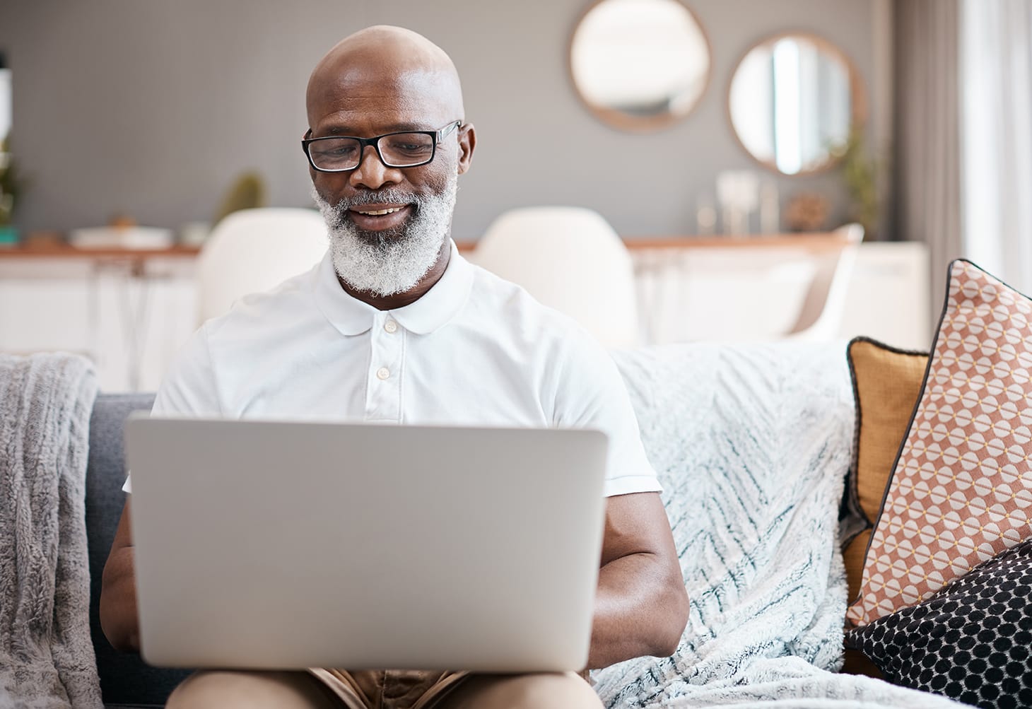 Man on couch using laptop