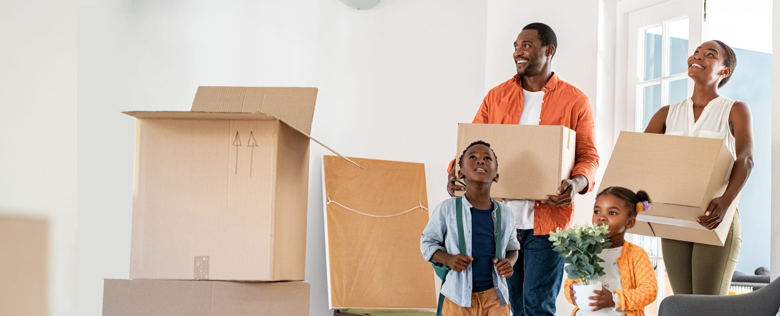 Happy Family moving into their new beautiful home