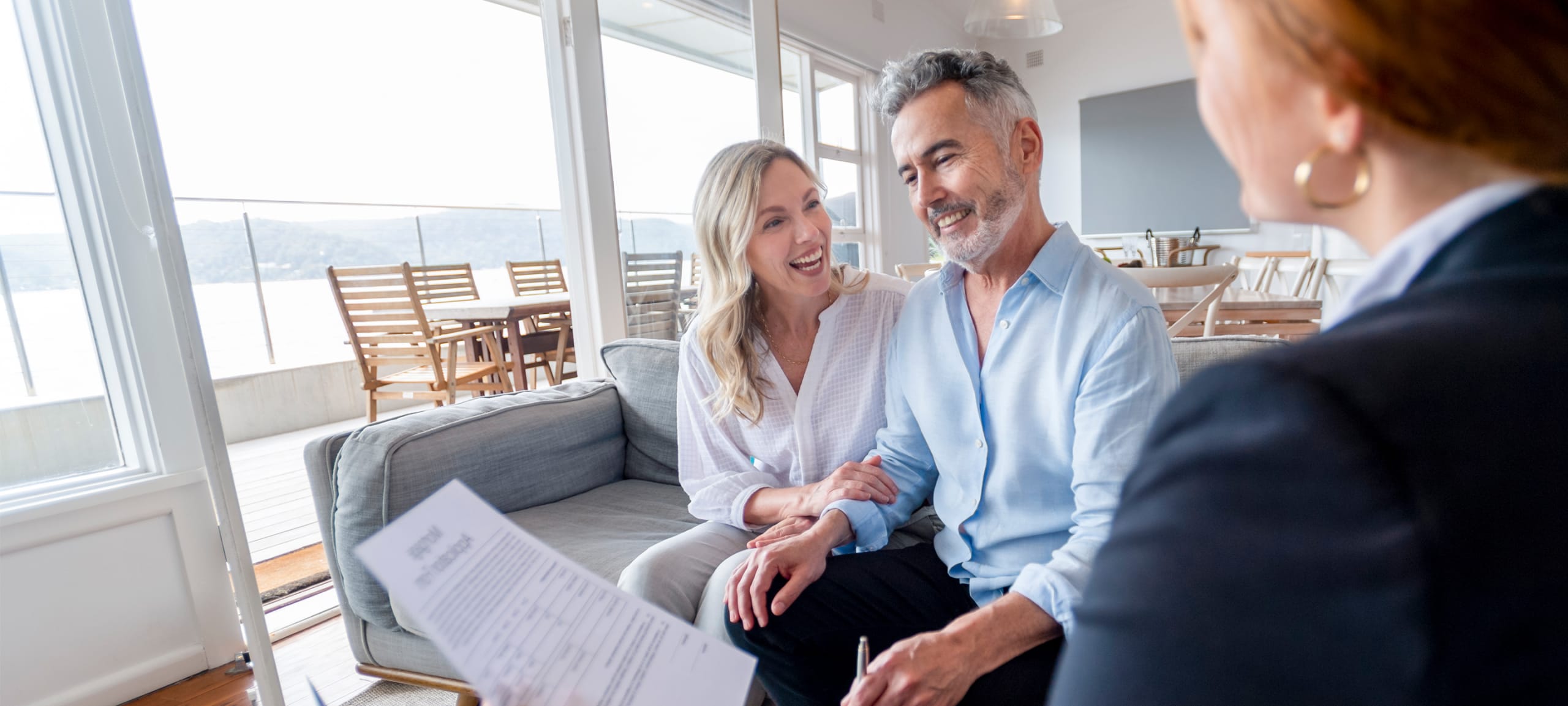 Couple signing papers for new house