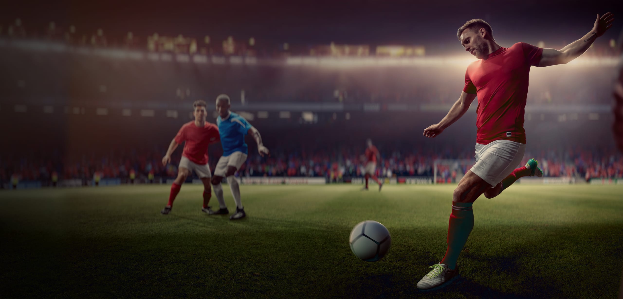 Soccer player kicking the ball