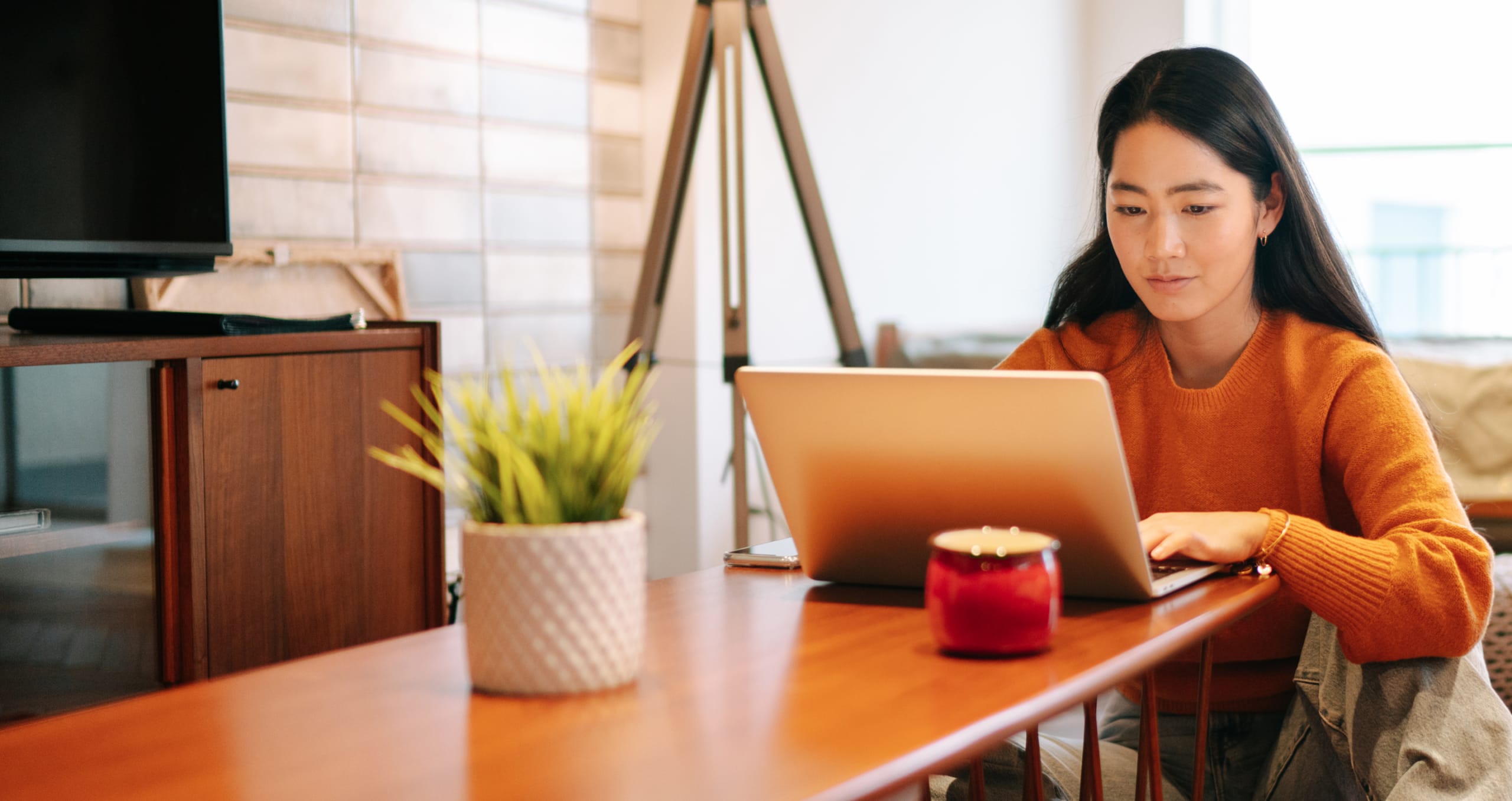 Woman using high speed internet on her laptop