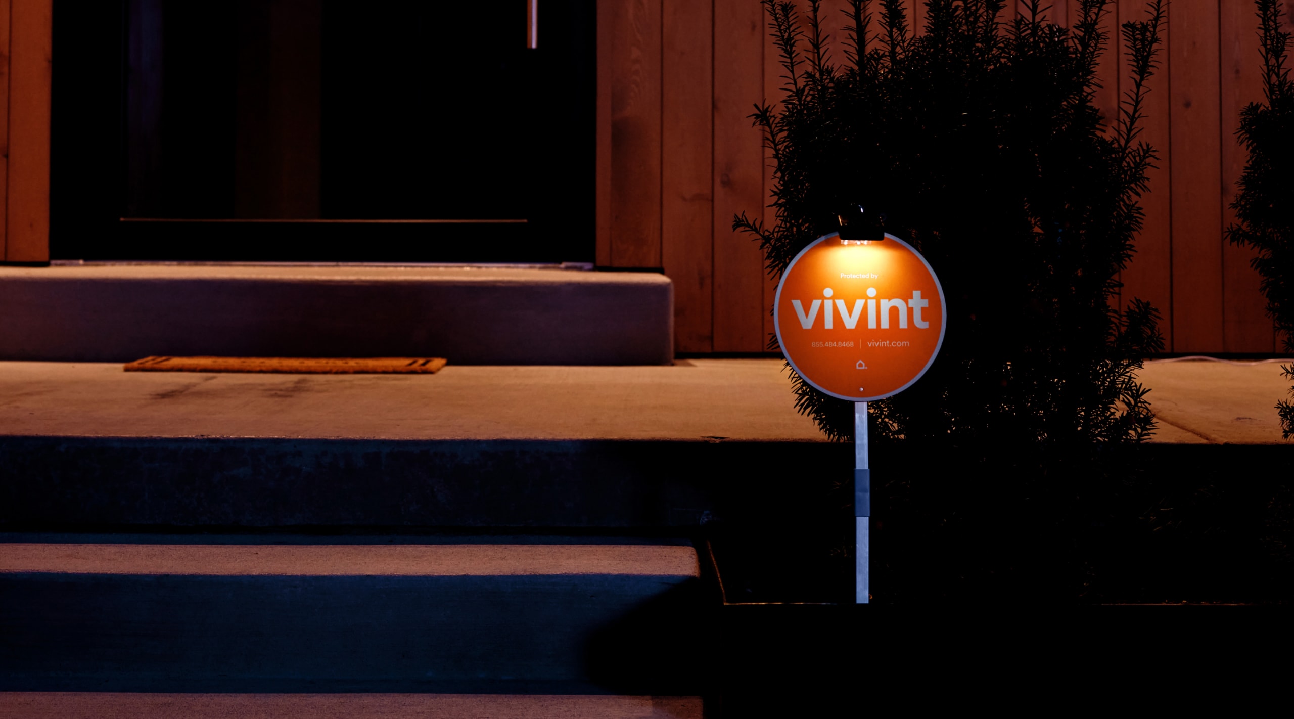 vivint sign by porch at night