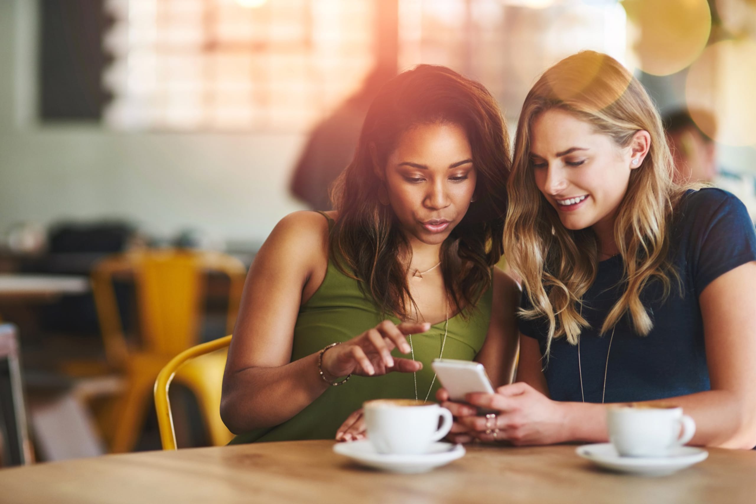 two friends using phone