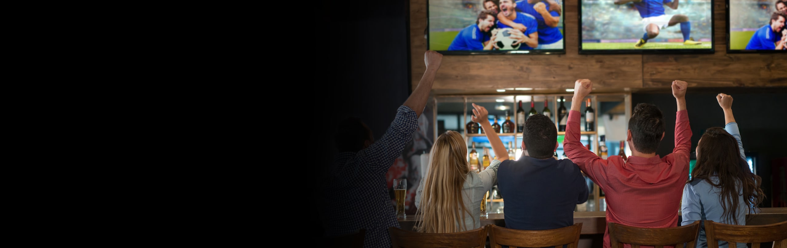 sports fans watching game on direct tv for business