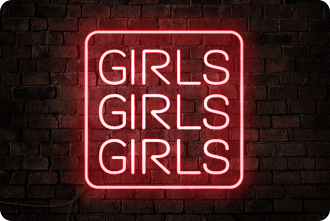 Letrero de neón brillante que dice "NIÑAS NIÑAS NIÑAS" Glowing neon sign declaring "GIRLS GIRLS GIRLS"