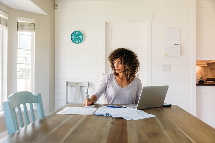 woman working at home on kitchen table