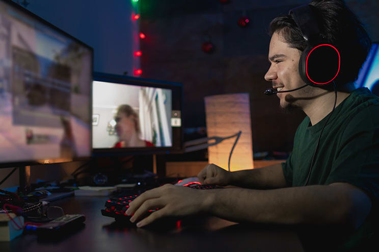 Man playing video games on computer