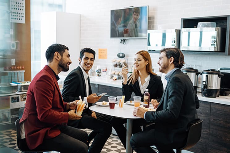 Employees eating lunch in the breakroom