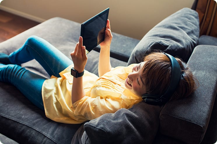 Woman streaming video on ipad.