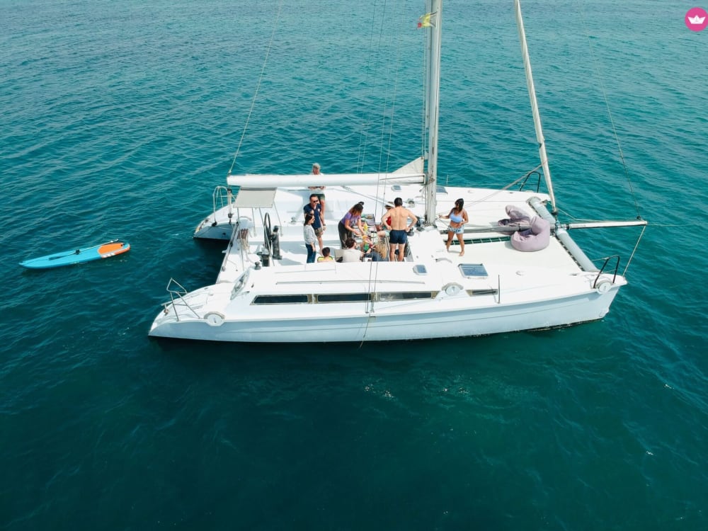 Discover Ibiza and Formentera by sea on a private 8-hour catamaran excursion.