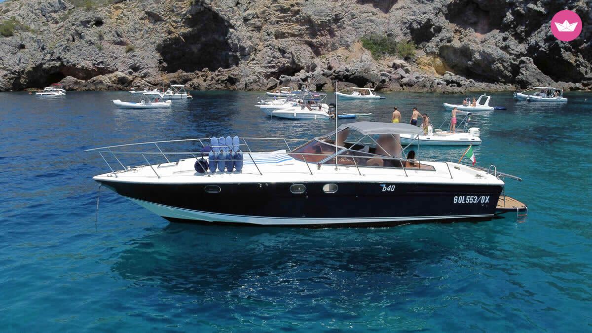 Full day Giglio Island escape: crystal waters & hidden beaches