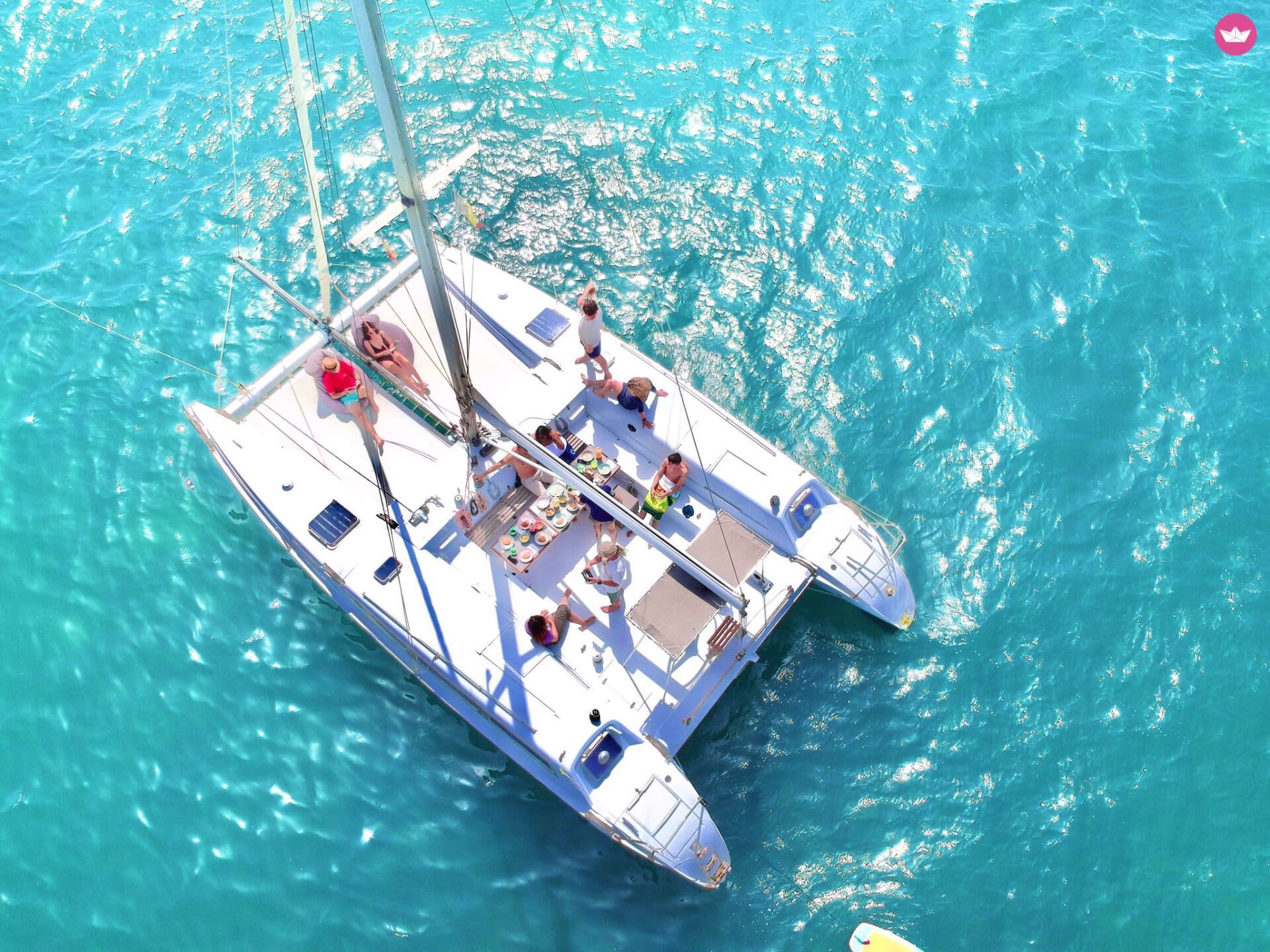 Discover Ibiza and Formentera by sea on a private 8-hour catamaran excursion.