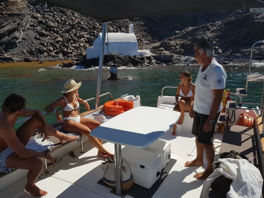 Οia Motor Boat-Caldera Private 4 hours Daytime or Sunset Cruise & Volcano Hike & Thirasia Island in Santorini