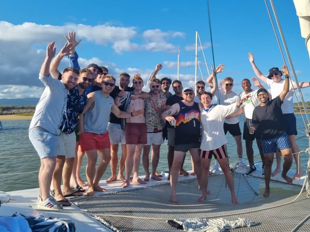 Discover Algarve coast as the sun sets on a catamaran