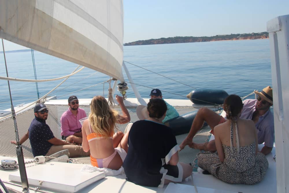 Discover Algarve coast as the sun sets on a catamaran