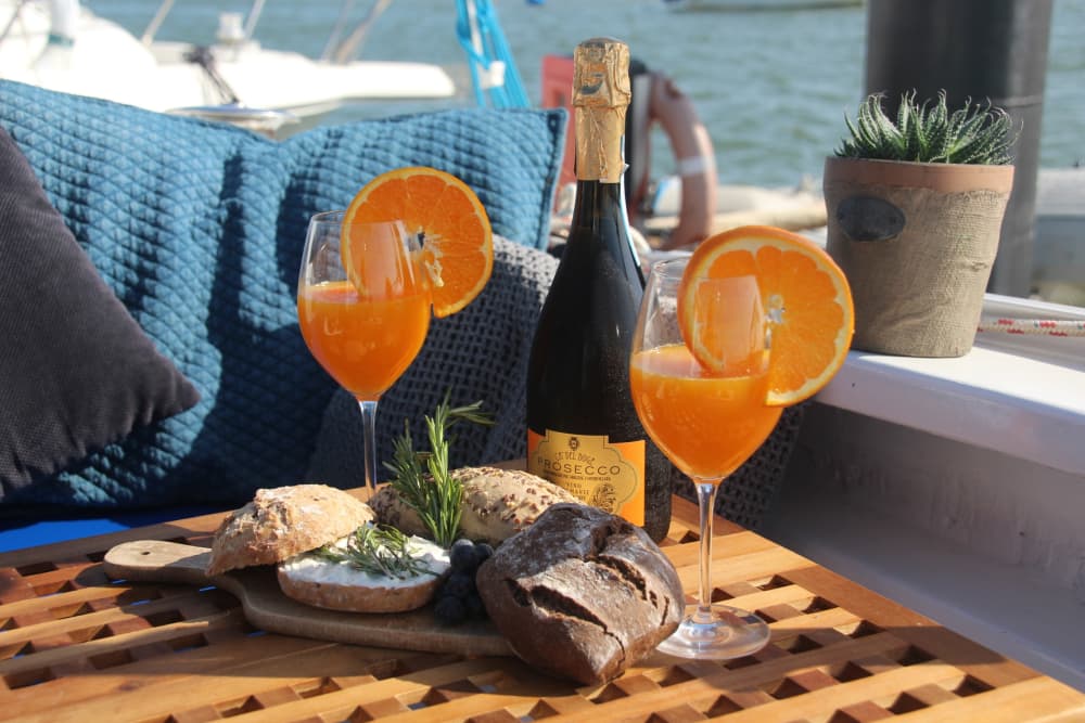 Discover Algarve coast as the sun sets on a catamaran