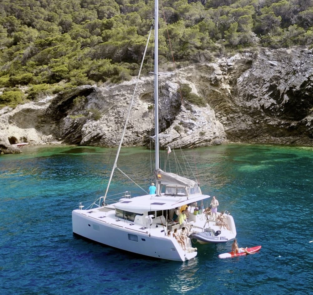 Spend a 8h sailing around Ibiza on a catamaran