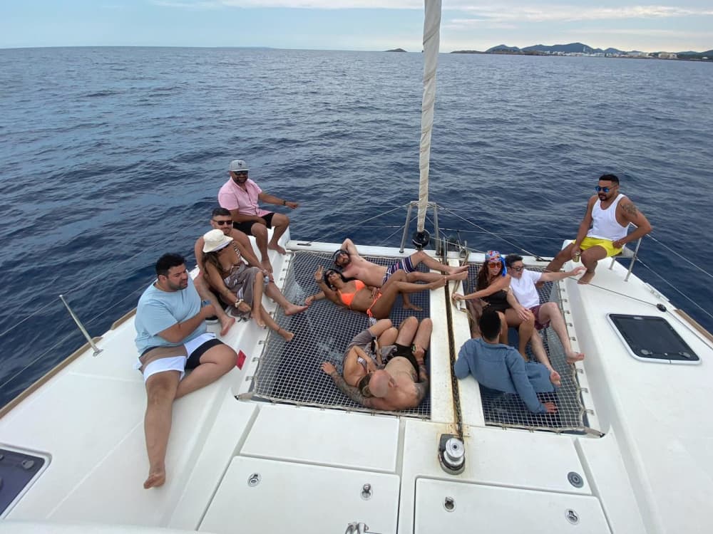 Spend a 8h sailing around Ibiza on a catamaran