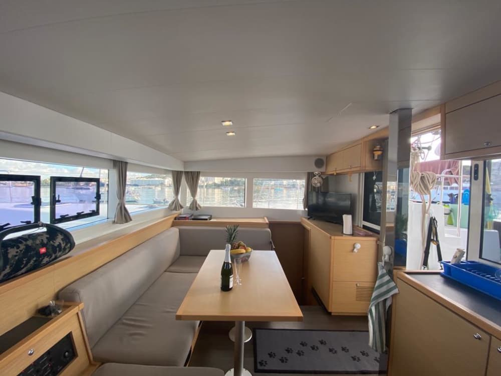 Spend a 8h sailing around Ibiza on a catamaran