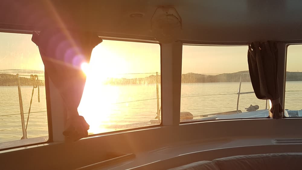 Sunset aperitif on a catamaran from Cannigione opposite Caprera