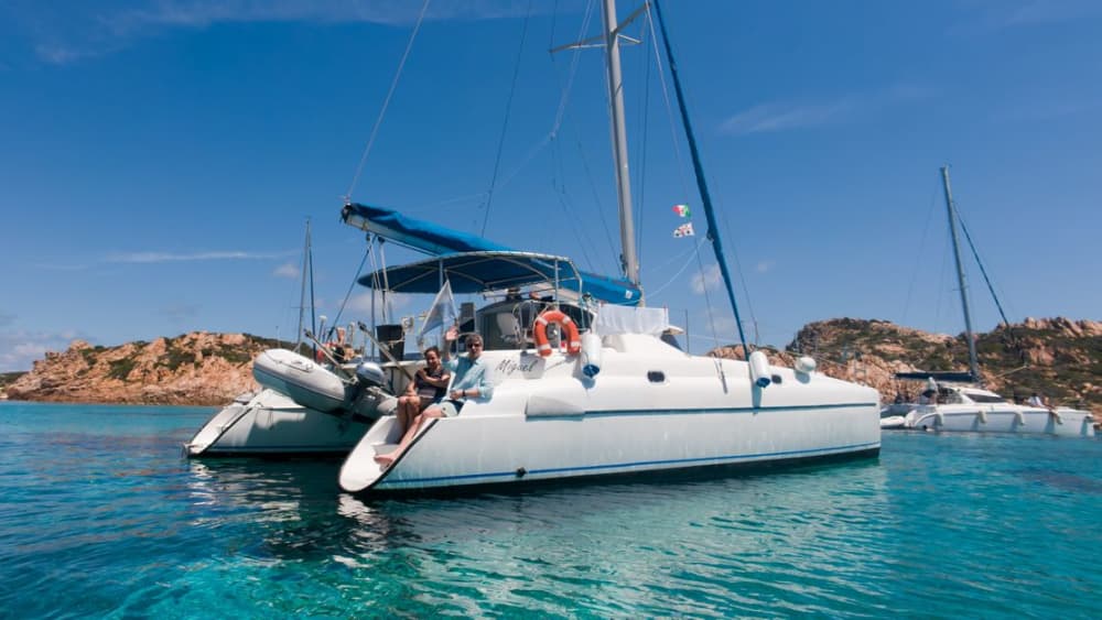 Full Day Catamaran from Cannigione: Nature, Sea and Wonder