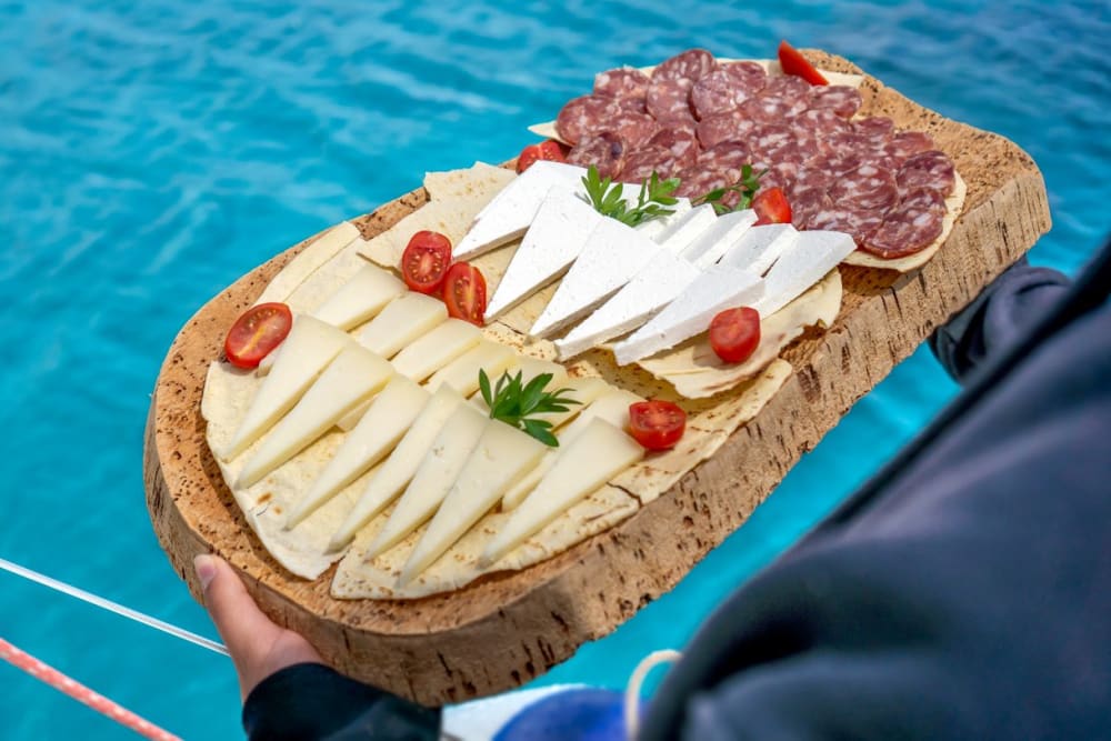 Full Day Catamaran from Cannigione: Nature, Sea and Wonder