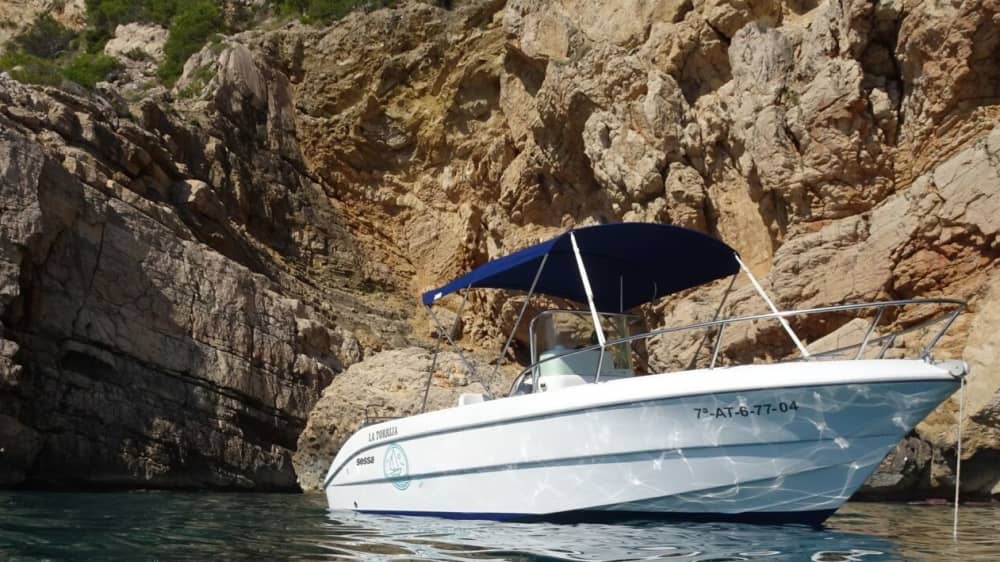 Discover Moraira's shores: A complete day trip aboard a motorboat