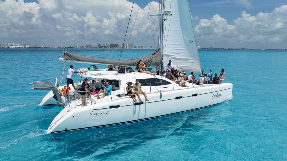 Sail, Snorkel, & Celebrate: Private Isla Mujeres Catamaran Adventure