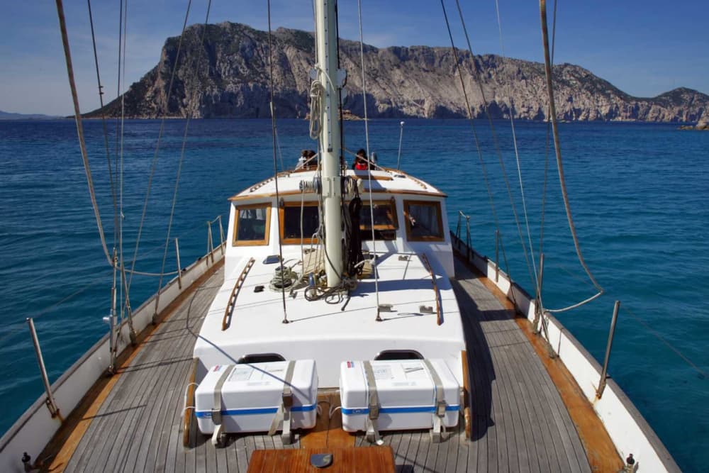 Between Tavolara and Cala Girgolu on a vintage sailing ship
