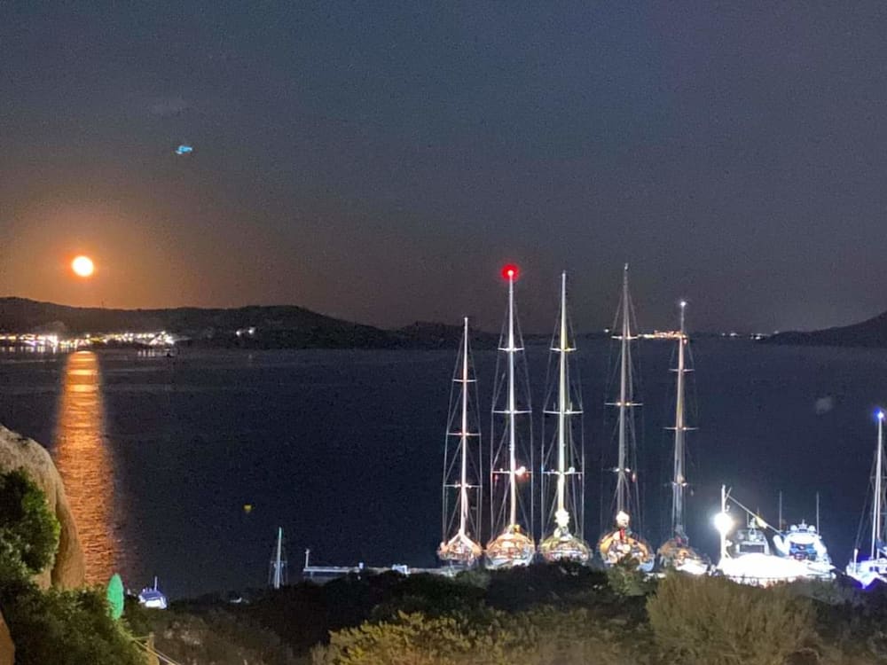 Exclusive sunset aboard a luxurious 14-meter catamaran in the heart of the Maddalena Archipelago with sunset over the Strait of Bonifacio