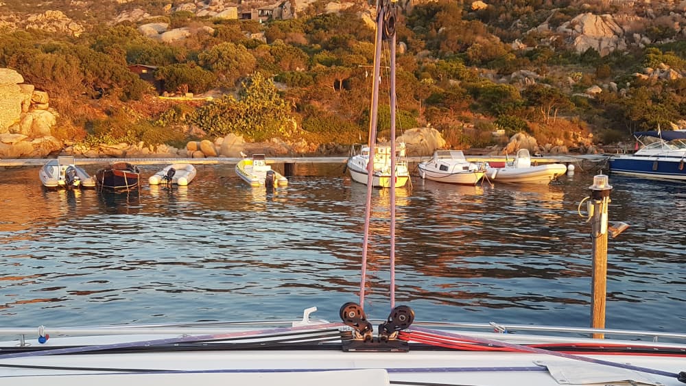 Exclusive sunset aboard a luxurious 14-meter catamaran in the heart of the Maddalena Archipelago with sunset over the Strait of Bonifacio