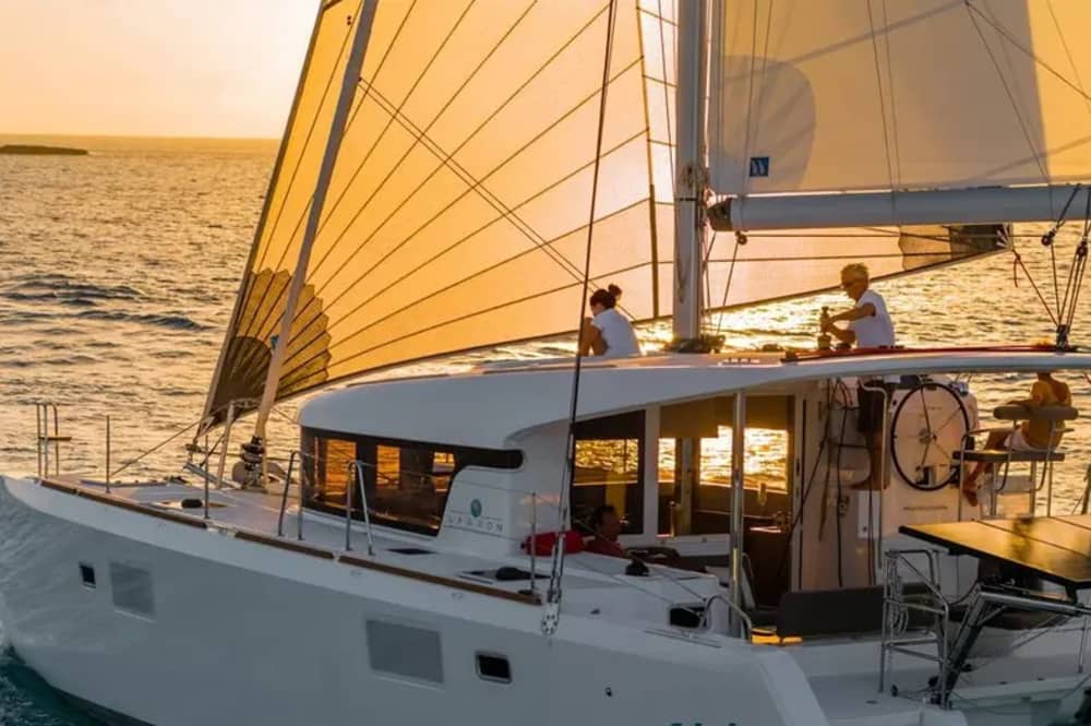 Exclusive sunset aboard a luxurious 14-meter catamaran in the heart of the Maddalena Archipelago with sunset over the Strait of Bonifacio