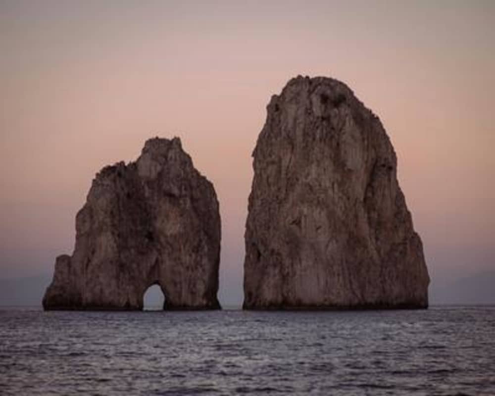 Capri Sunset: Elite Cruise to the Mythical Faraglioni